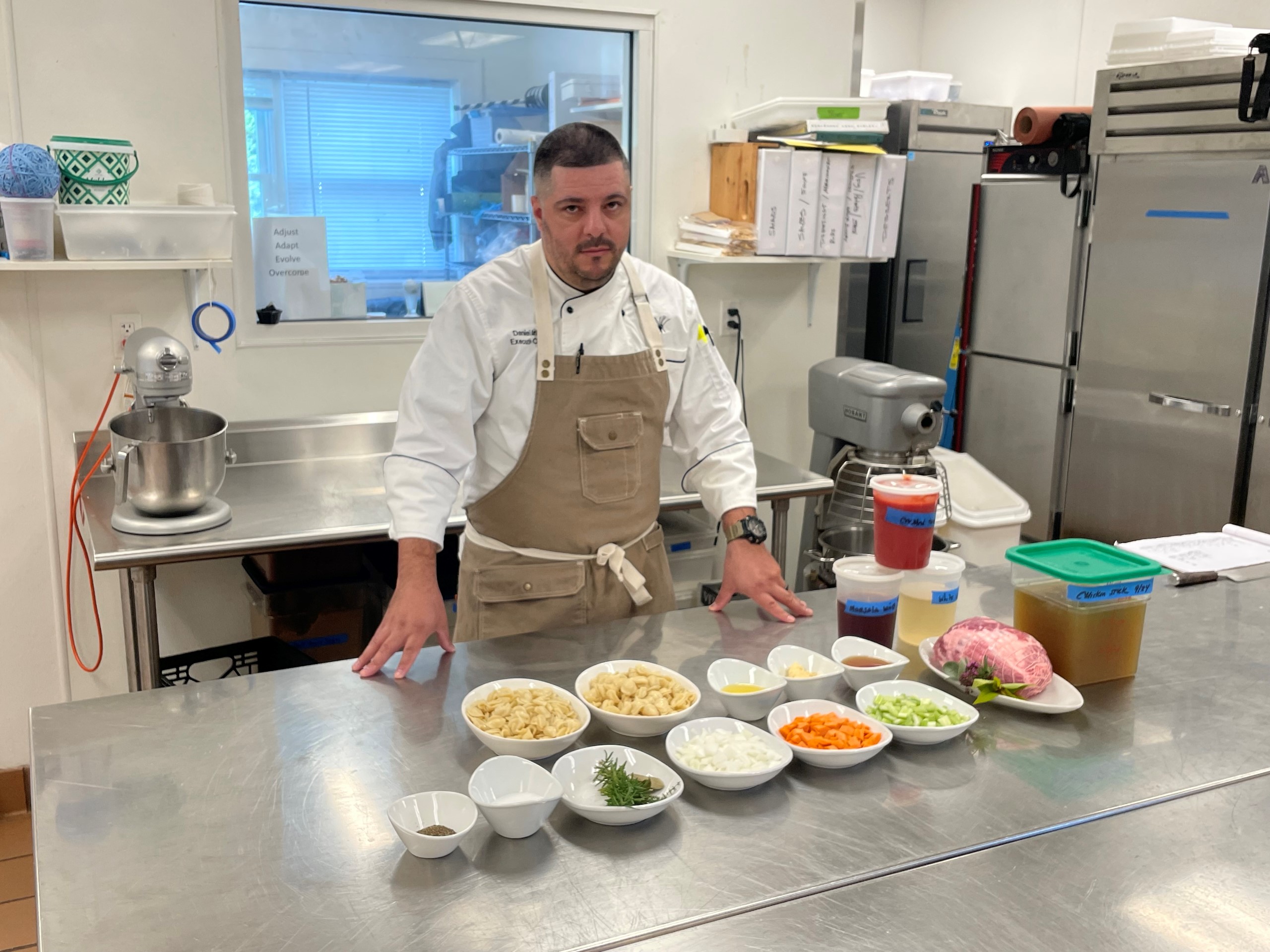 Chef Dan Murillo with ingredients for featured dish.